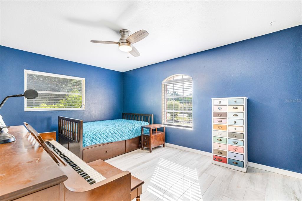 28522 Coco Palm Drive Punta Gorda, FL 33982 - Photo 23 of 54 a bedroom with a bed and window