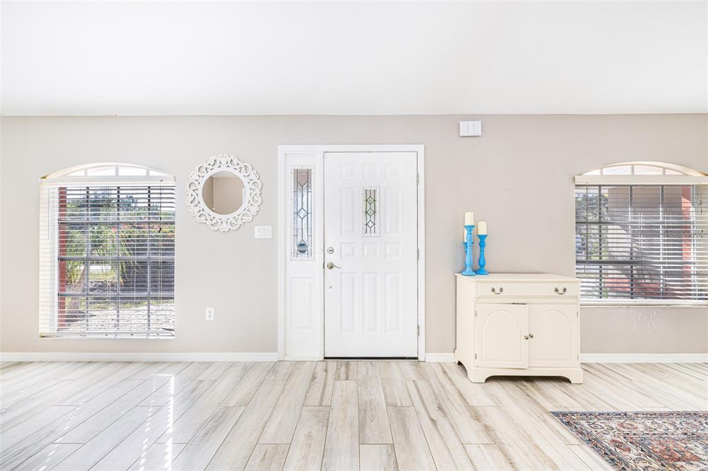 28522 Coco Palm Drive Punta Gorda, FL 33982 - Photo 3 of 54 an empty room with windows