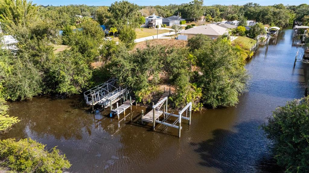 28522 Coco Palm Drive Punta Gorda, FL 33982 - Photo 52 of 54 an aerial view of a house with a yard lake lake and mountain view