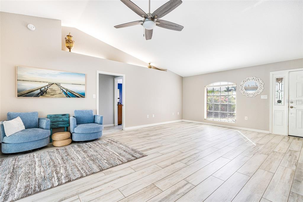28522 Coco Palm Drive Punta Gorda, FL 33982 - Photo 7 of 54 a living room with furniture and a window