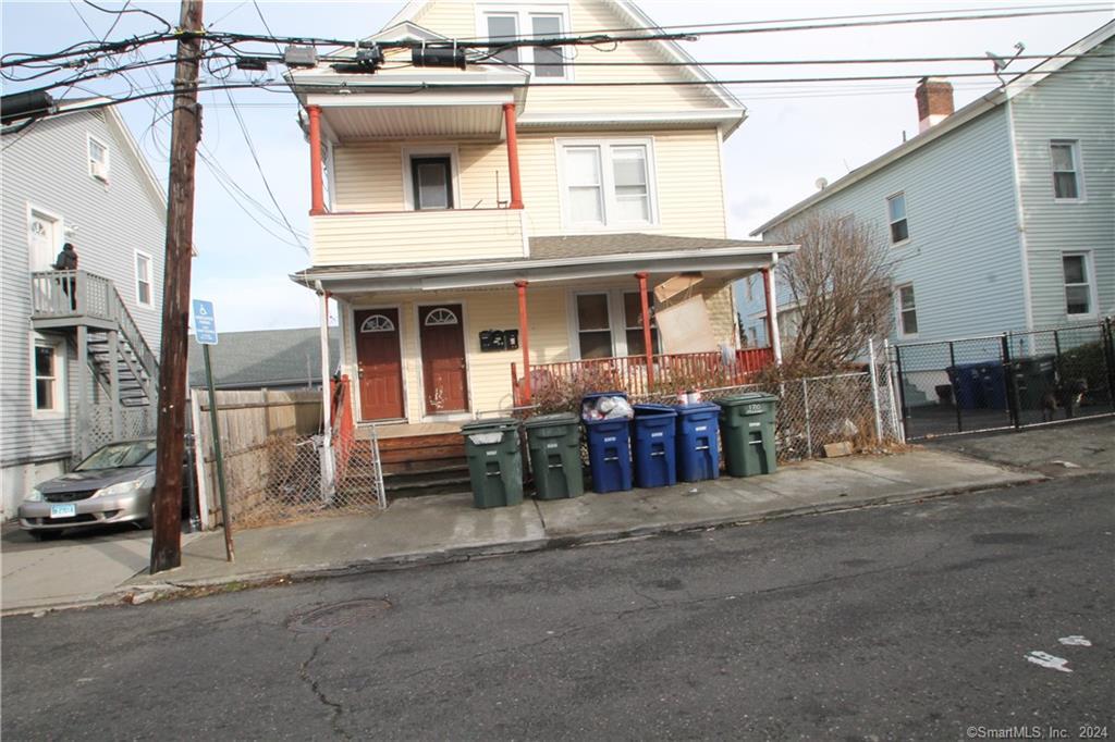 170 Milne Street Bridgeport, CT 06604 - Photo 1 of 1 a view of a house with a barbeque and wooden stairs
