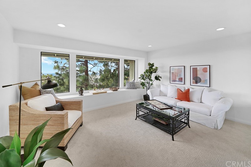 23 Coventry Newport Beach, CA 92660 - Photo 12 of 16 a living room with furniture and a large window