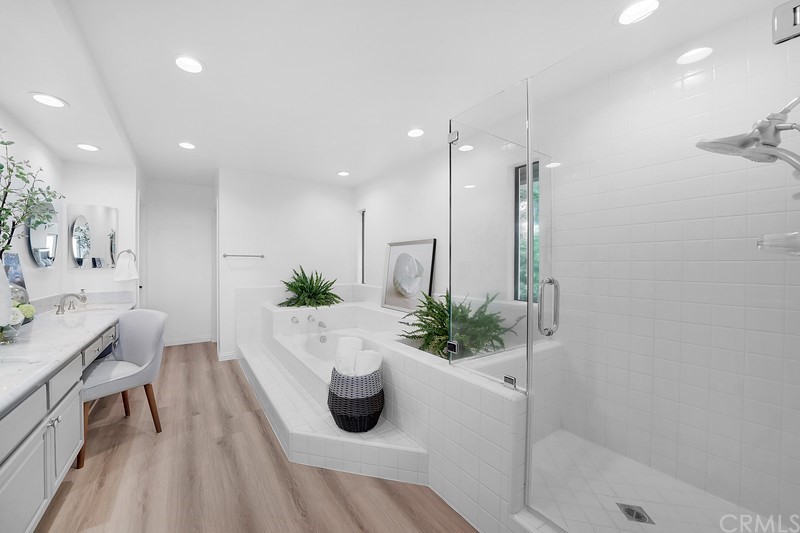 23 Coventry Newport Beach, CA 92660 - Photo 13 of 16 a large white kitchen with a potted plant