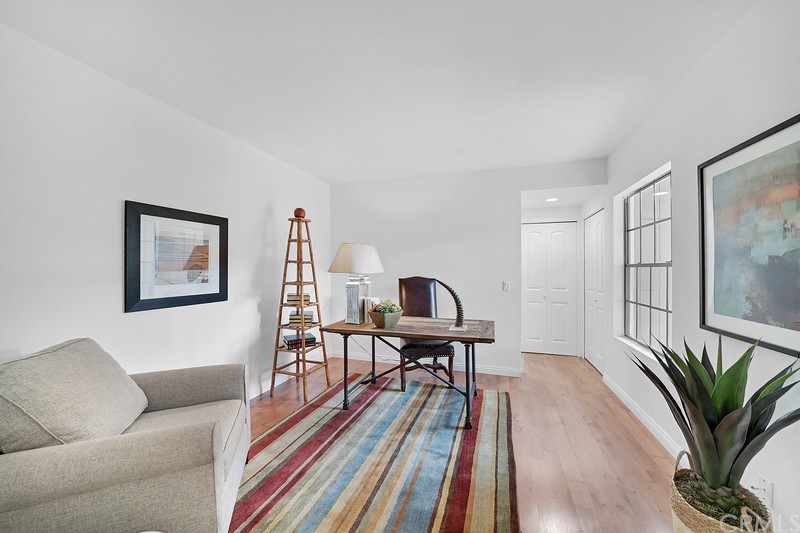 23 Coventry Newport Beach, CA 92660 - Photo 14 of 16 a living room with furniture a table and wooden floor