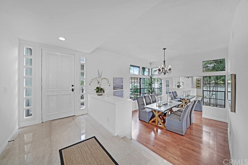23 Coventry Newport Beach, CA 92660 - Photo 3 of 16 a living room with furniture floor to ceiling window and wooden floor