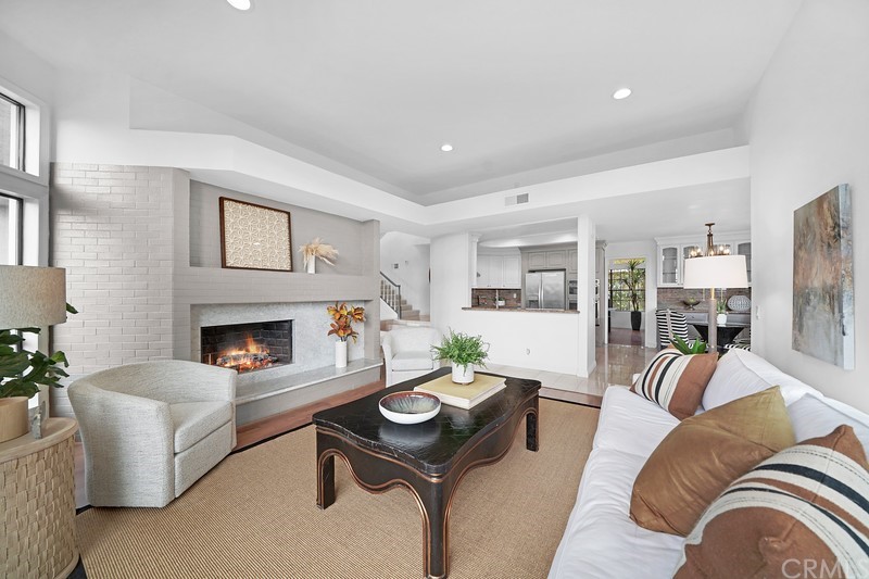 23 Coventry Newport Beach, CA 92660 - Photo 10 of 16 a living room with furniture and a fireplace