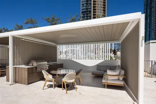 a balcony with table and chairs
