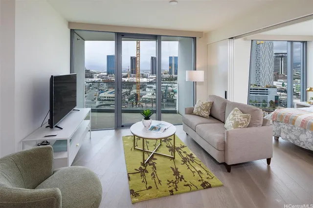 a living room with furniture and a large window