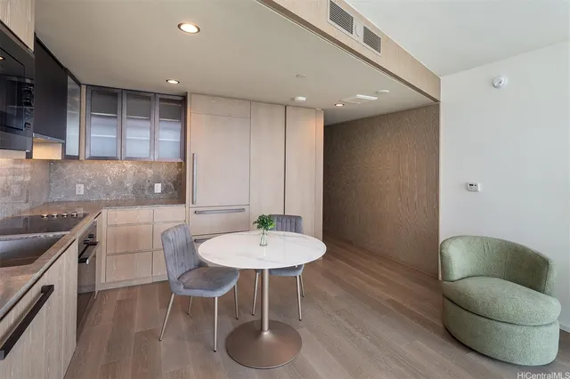 a kitchen with a table and chairs in it