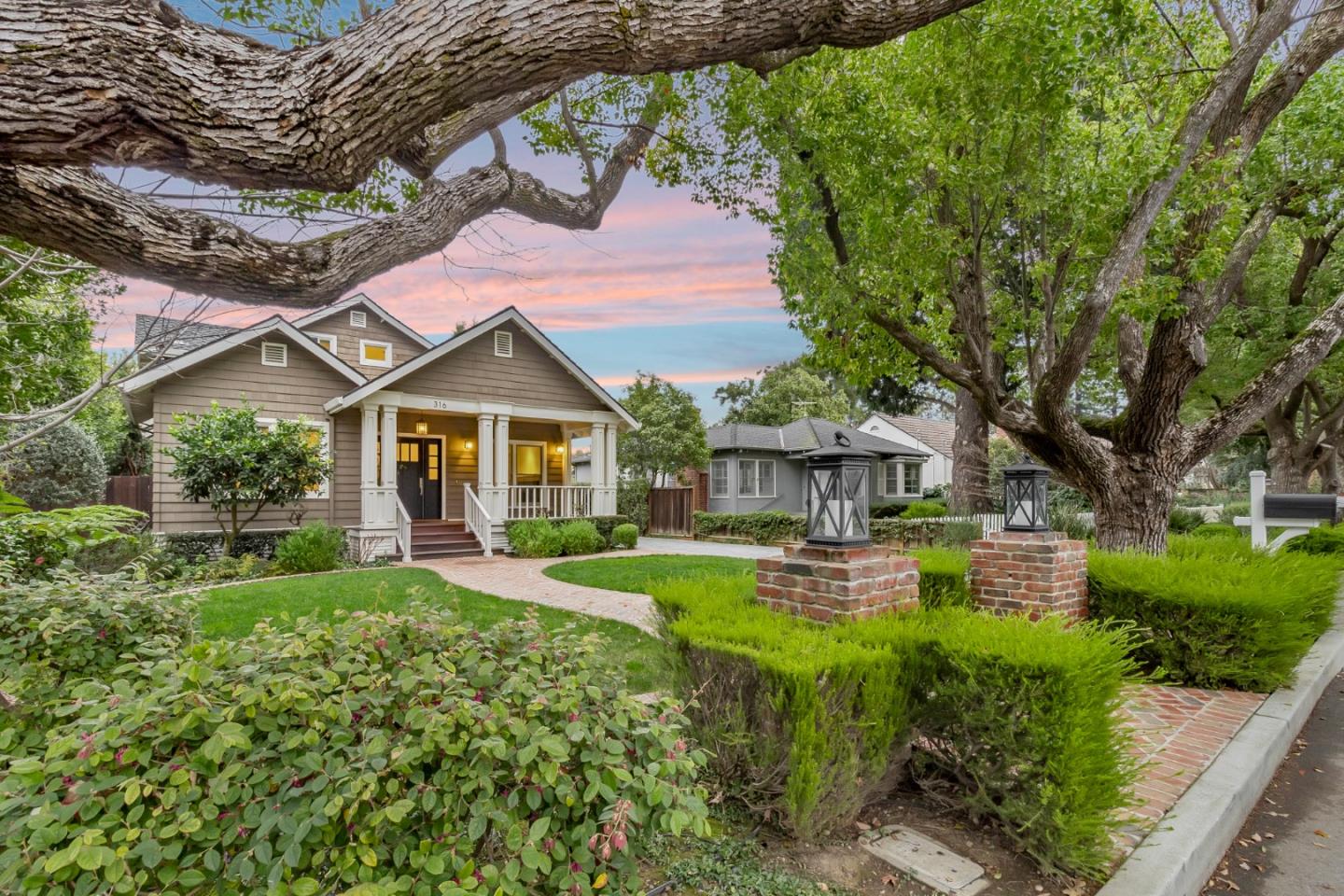 a front view of a house with garden