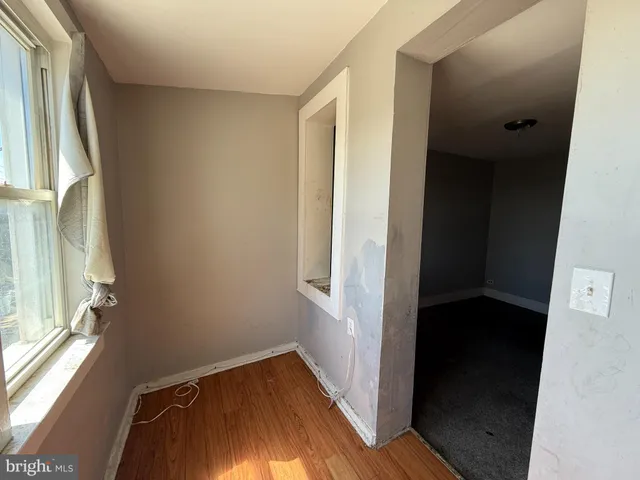 a view of front door with wooden floor