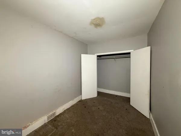 an empty room with closet