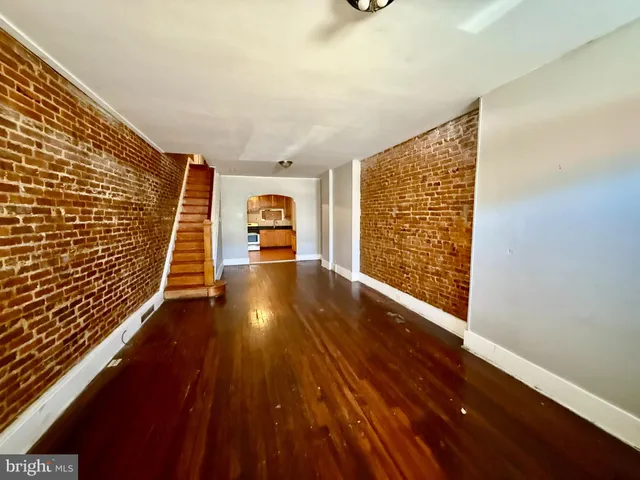 a view of an empty room with stairs