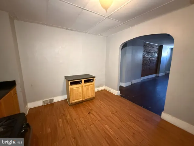 a spacious bathroom with a sink and a mirror