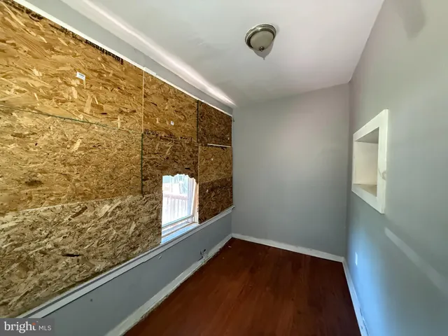 a view of an empty room and window