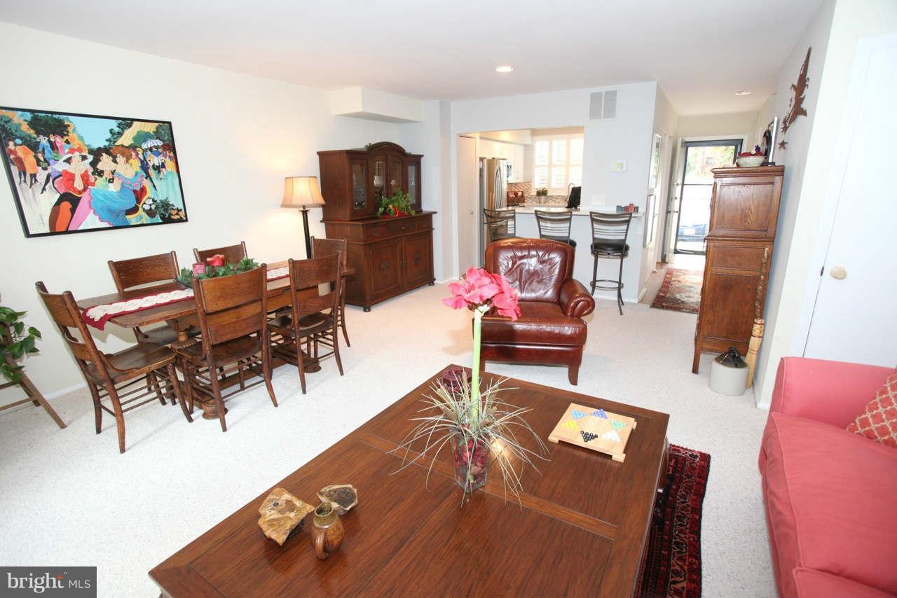 14 Stone Ridge Court, Unit 25 Baltimore, MD 21239 - Photo 13 of 30 a living room with furniture and a flat screen tv