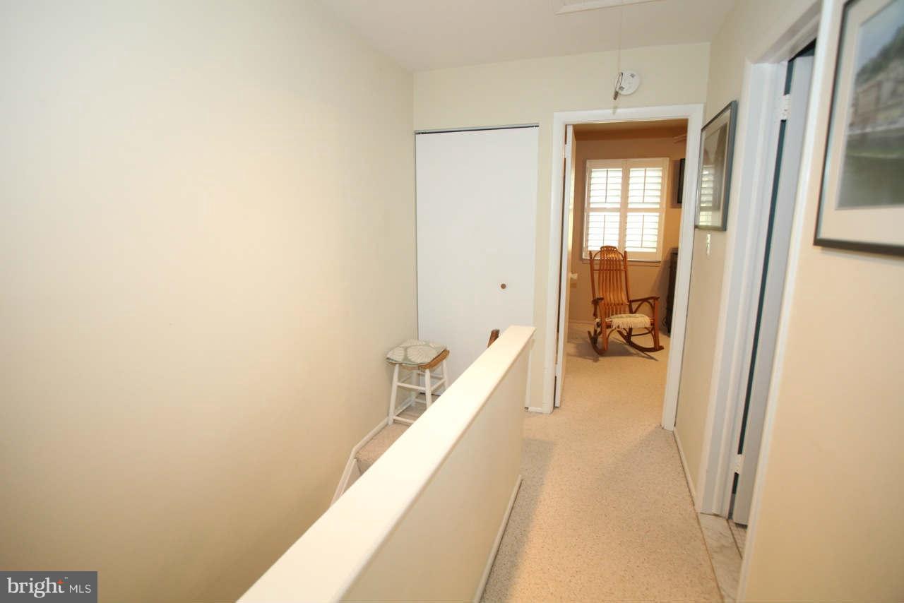 14 Stone Ridge Court, Unit 25 Baltimore, MD 21239 - Photo 15 of 30 a hallway with a wooden floor