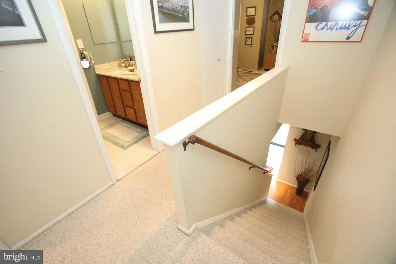 14 Stone Ridge Court, Unit 25 Baltimore, MD 21239 - Photo 20 of 30 a view of a hallway with staircase