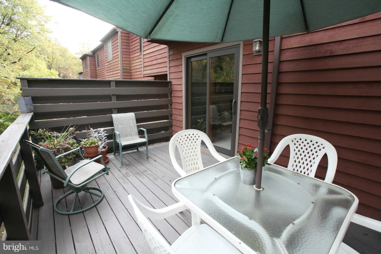 14 Stone Ridge Court, Unit 25 Baltimore, MD 21239 - Photo 23 of 30 a view of outdoor sitting area with furniture and wooden floor