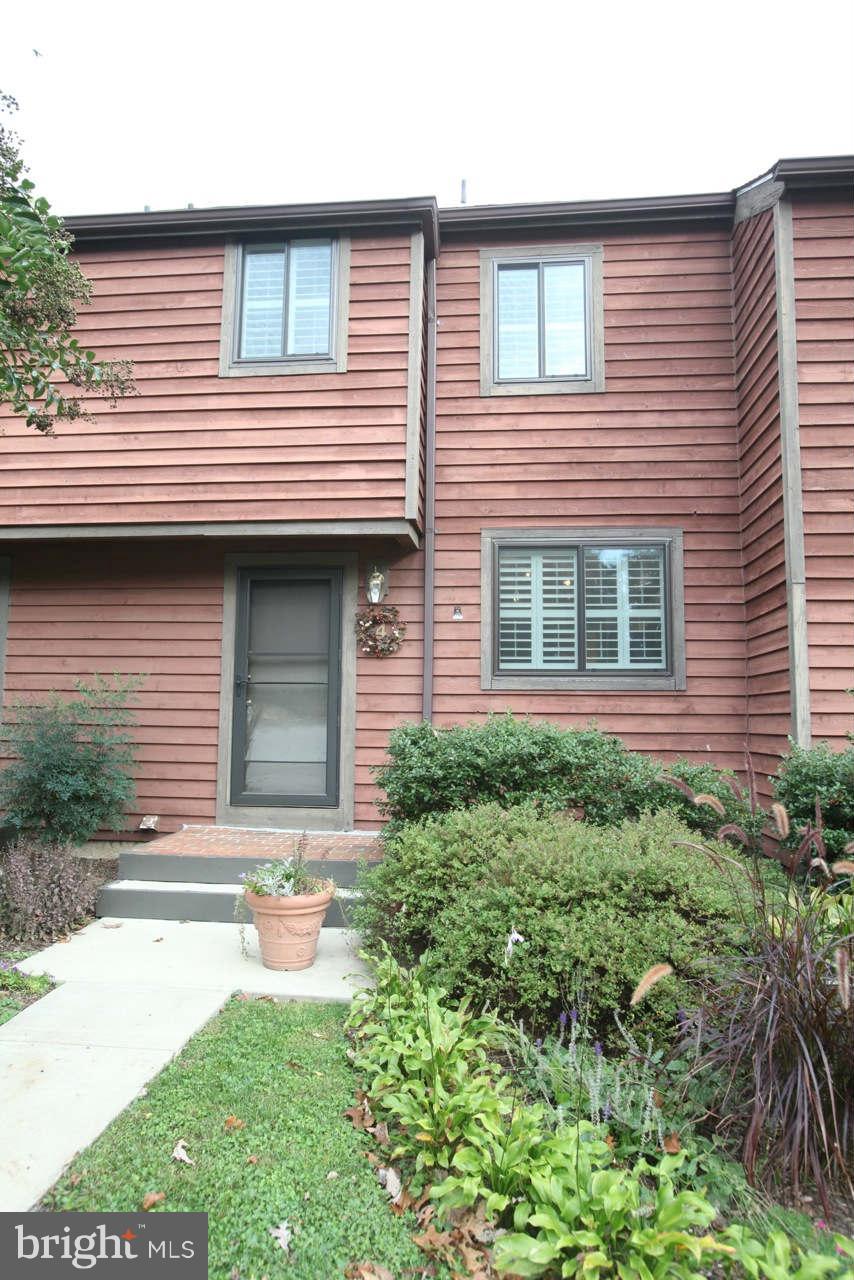 14 Stone Ridge Court, Unit 25 Baltimore, MD 21239 - Photo 26 of 30 a front view of a house with a yard