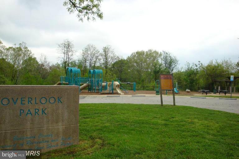 14 Stone Ridge Court, Unit 25 Baltimore, MD 21239 - Photo 30 of 30 a view of a park with swings and slides