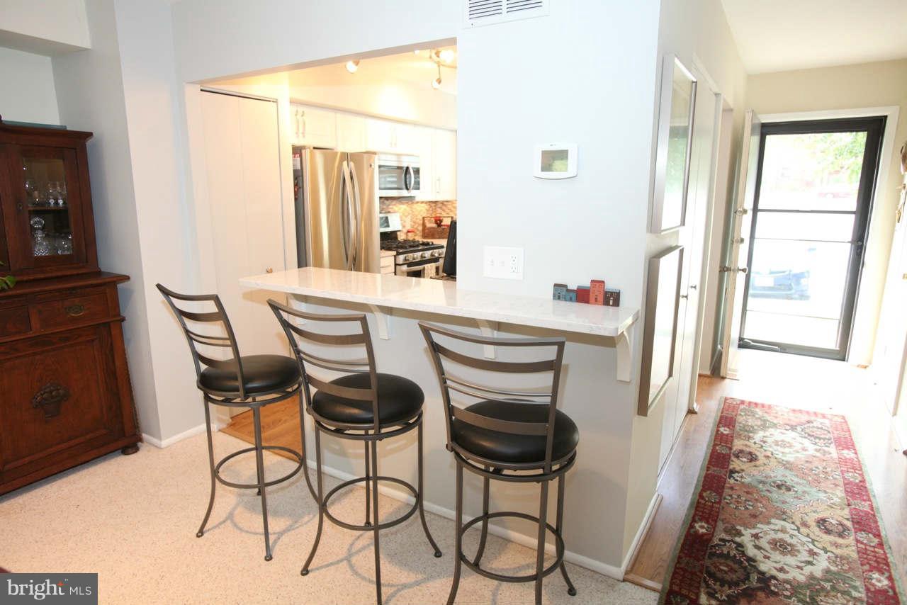 14 Stone Ridge Court, Unit 25 Baltimore, MD 21239 - Photo 7 of 30 a dining room with furniture and window