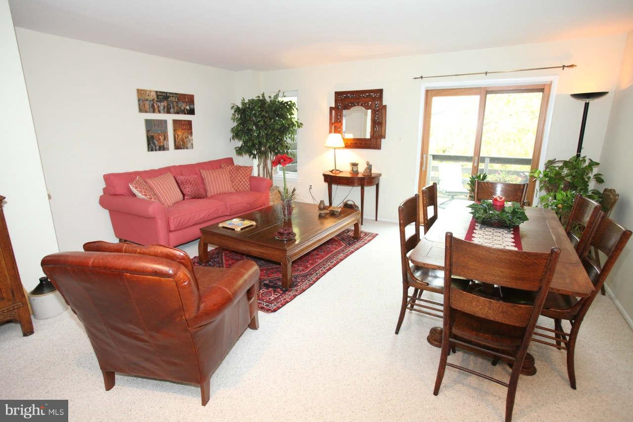 14 Stone Ridge Court, Unit 25 Baltimore, MD 21239 - Photo 10 of 30 a living room with furniture and a window