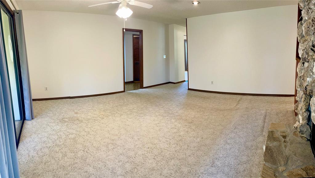 4524 Southeast 11th Place Ocala, FL 34471 - Photo 12 of 31 a view of an empty room with a kitchen
