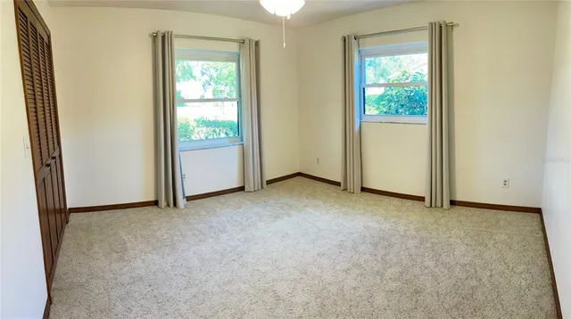 an empty room with windows