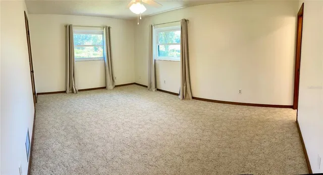 an empty room with windows