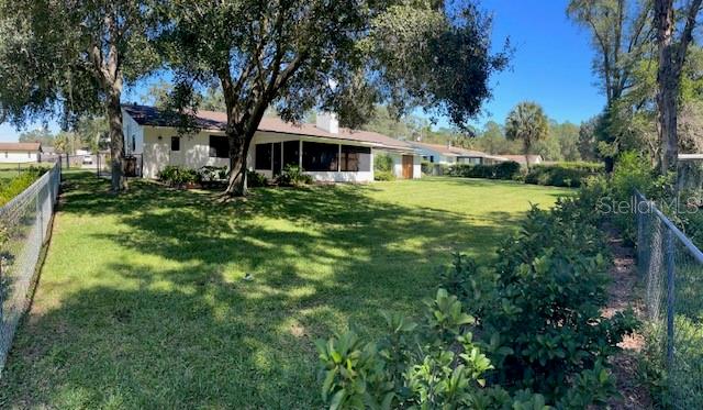 4524 Southeast 11th Place Ocala, FL 34471 - Photo 28 of 31 a front view of a house with a garden