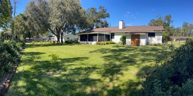 4524 Southeast 11th Place Ocala, FL 34471 - Photo 30 of 31 a front view of a house with a yard