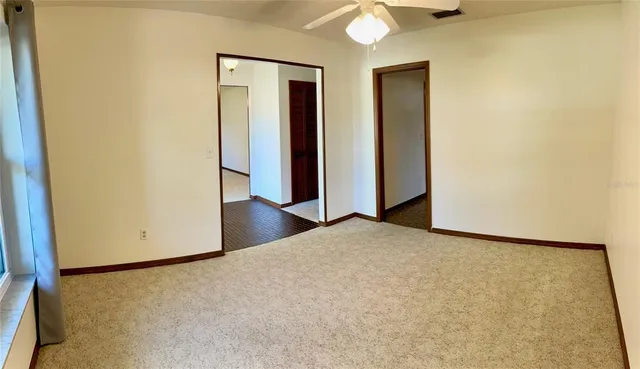 an empty room with closet area