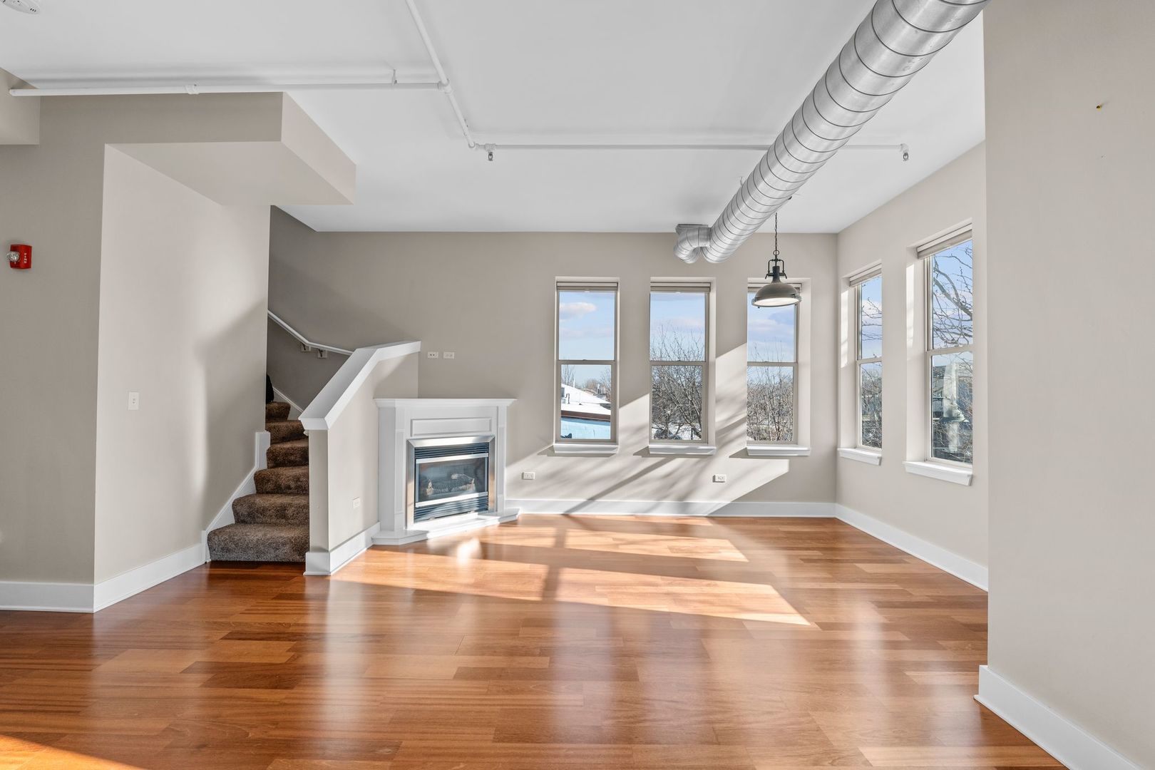351 Front Street, Unit 2212 Lemont, IL 60439 - Photo 11 of 36 a view of a livingroom with wooden floor