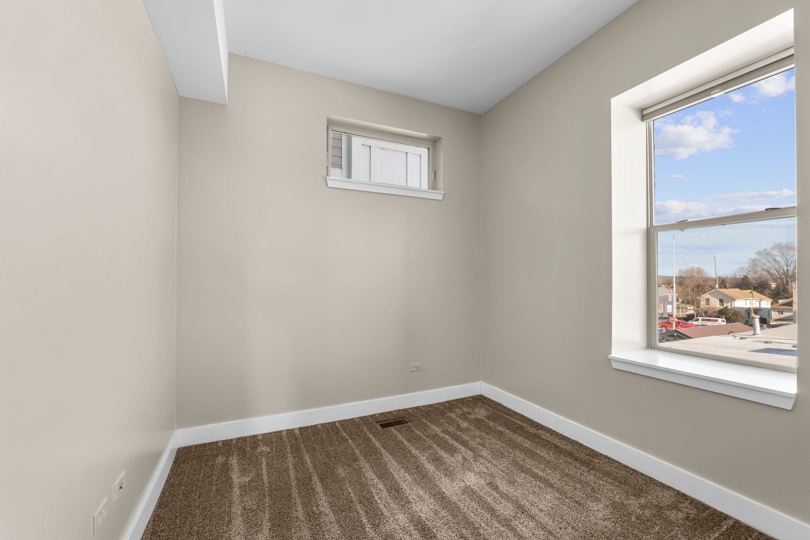 351 Front Street, Unit 2212 Lemont, IL 60439 - Photo 25 of 36 a view of a big room with wooden floor and windows