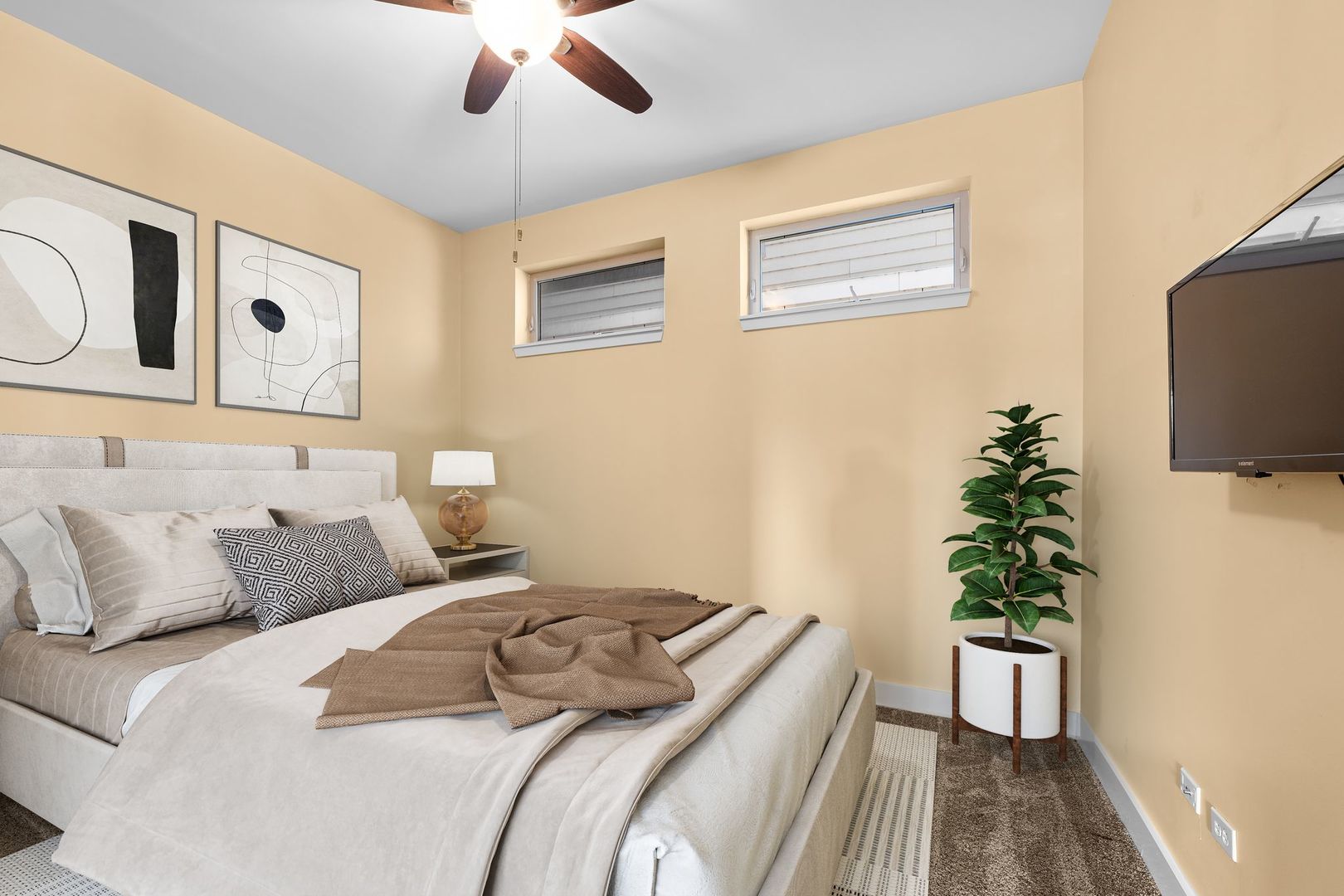 351 Front Street, Unit 2212 Lemont, IL 60439 - Photo 32 of 36 a bedroom with a bed and a potted plant