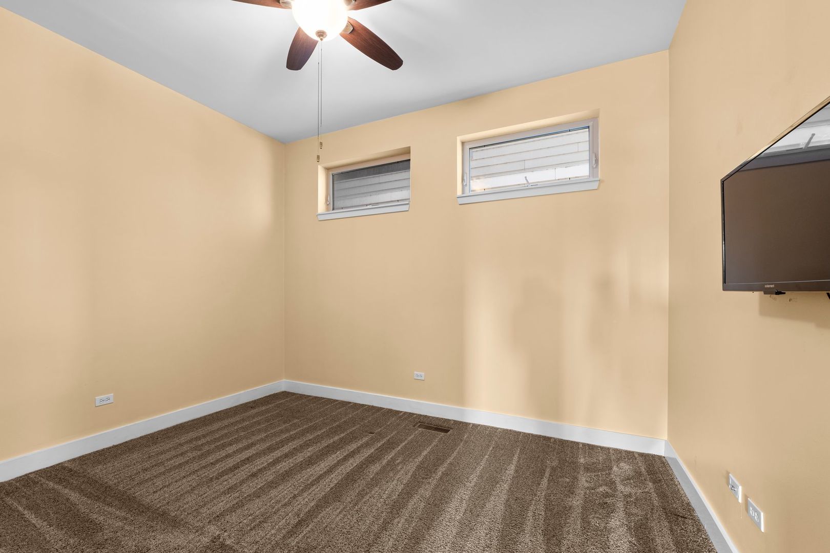 351 Front Street, Unit 2212 Lemont, IL 60439 - Photo 33 of 36 a view of empty room with wooden floor and fan