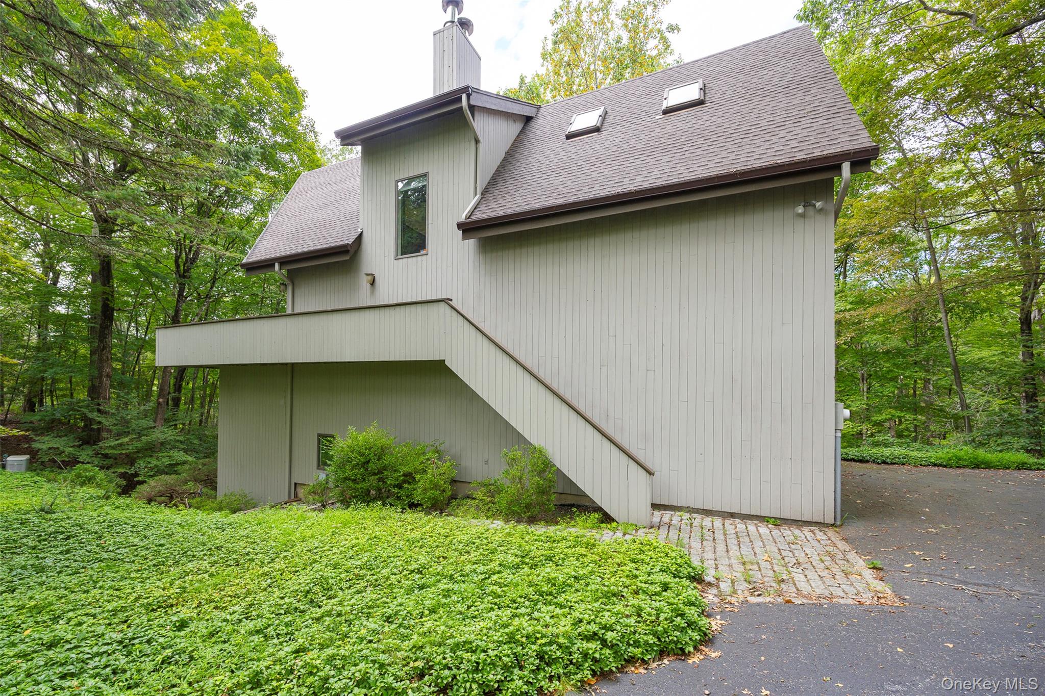 a house with trees in front of it