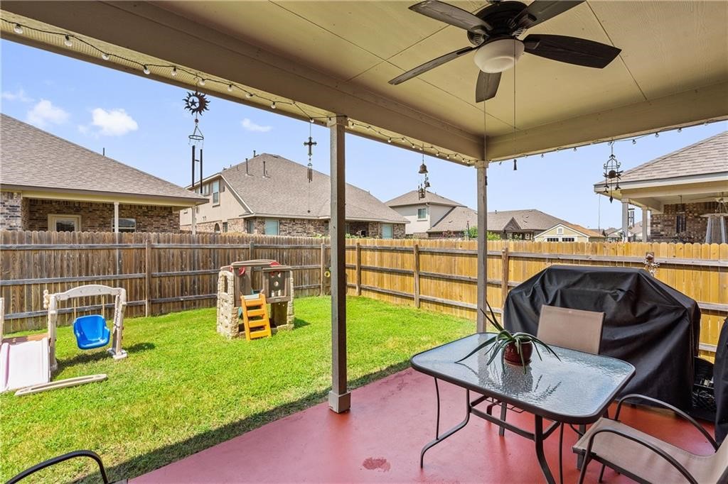 601 Flag Lane Leander, TX 78641 - Photo 28 of 38 a view of a patio with a table and chairs
