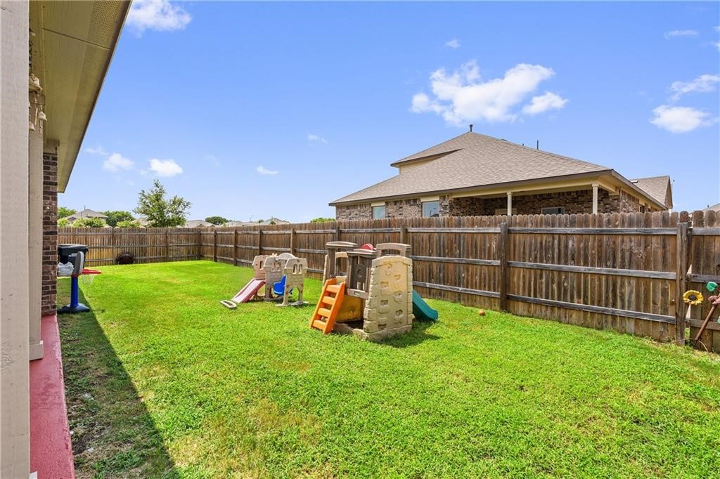 601 Flag Lane Leander, TX 78641 - Photo 29 of 38 a view of a garden with a slide