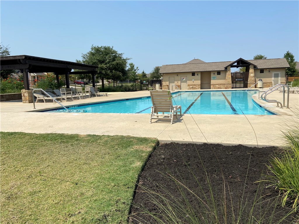 601 Flag Lane Leander, TX 78641 - Photo 35 of 38 a view of a swimming pool with an outdoor seating