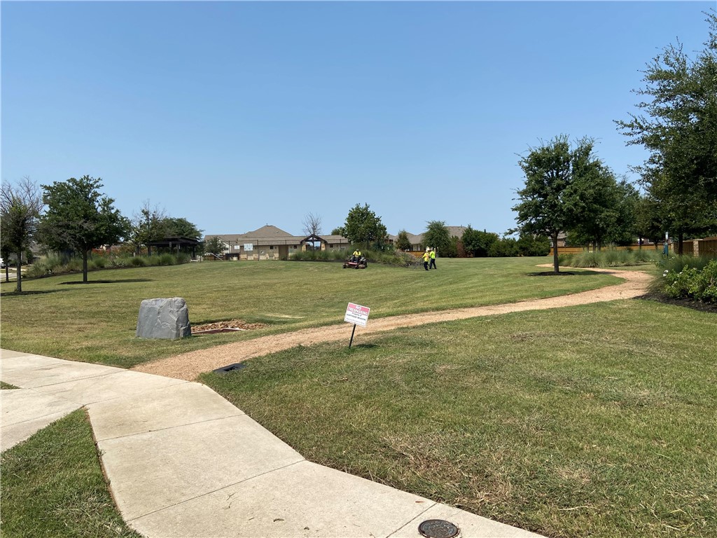601 Flag Lane Leander, TX 78641 - Photo 36 of 38 a view of a lake with a yard and large trees