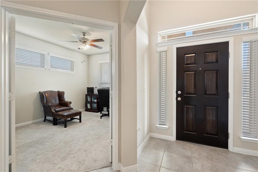 601 Flag Lane Leander, TX 78641 - Photo 5 of 38 a view of a workspace with furniture and windows