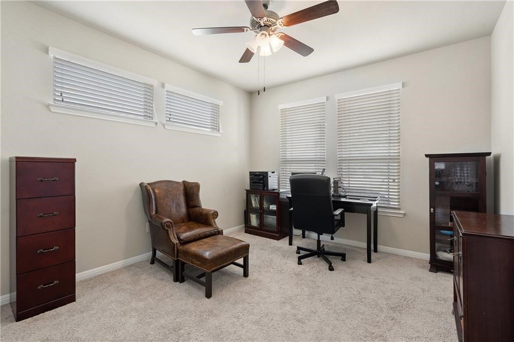 601 Flag Lane Leander, TX 78641 - Photo 6 of 38 a view of a workspace with furniture and a window