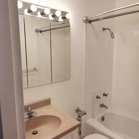 a bathroom with a sink and shower