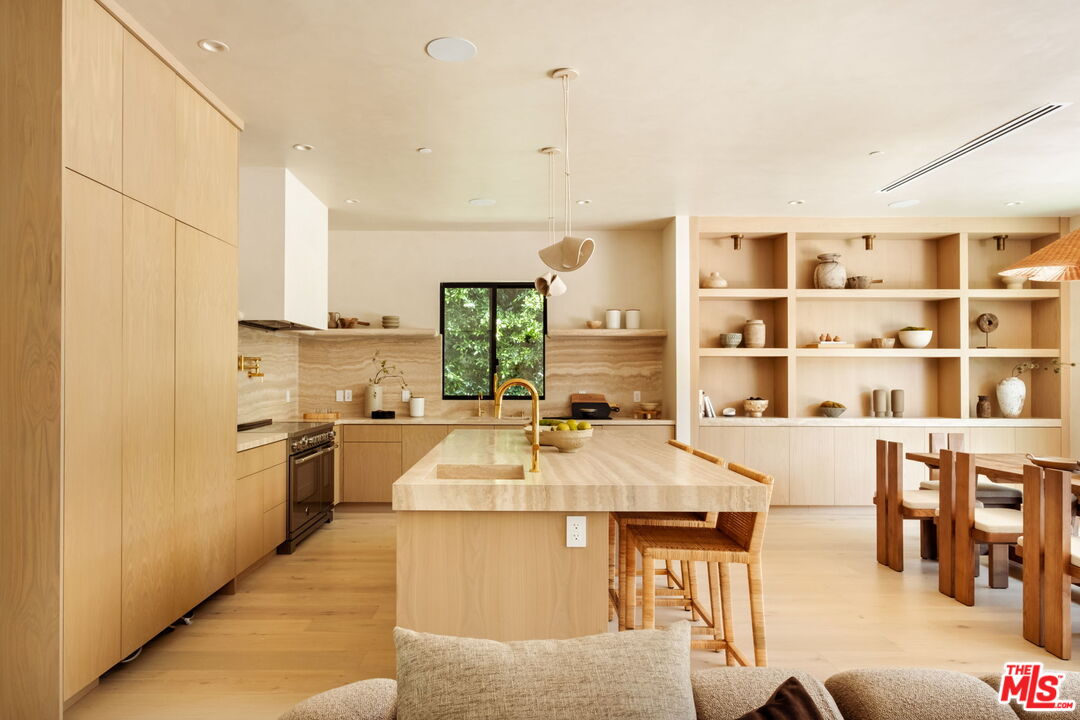 636 North Laurel Avenue Los Angeles, CA 90048 - Photo 14 of 31 a large kitchen with kitchen island a large counter space and stainless steel appliances