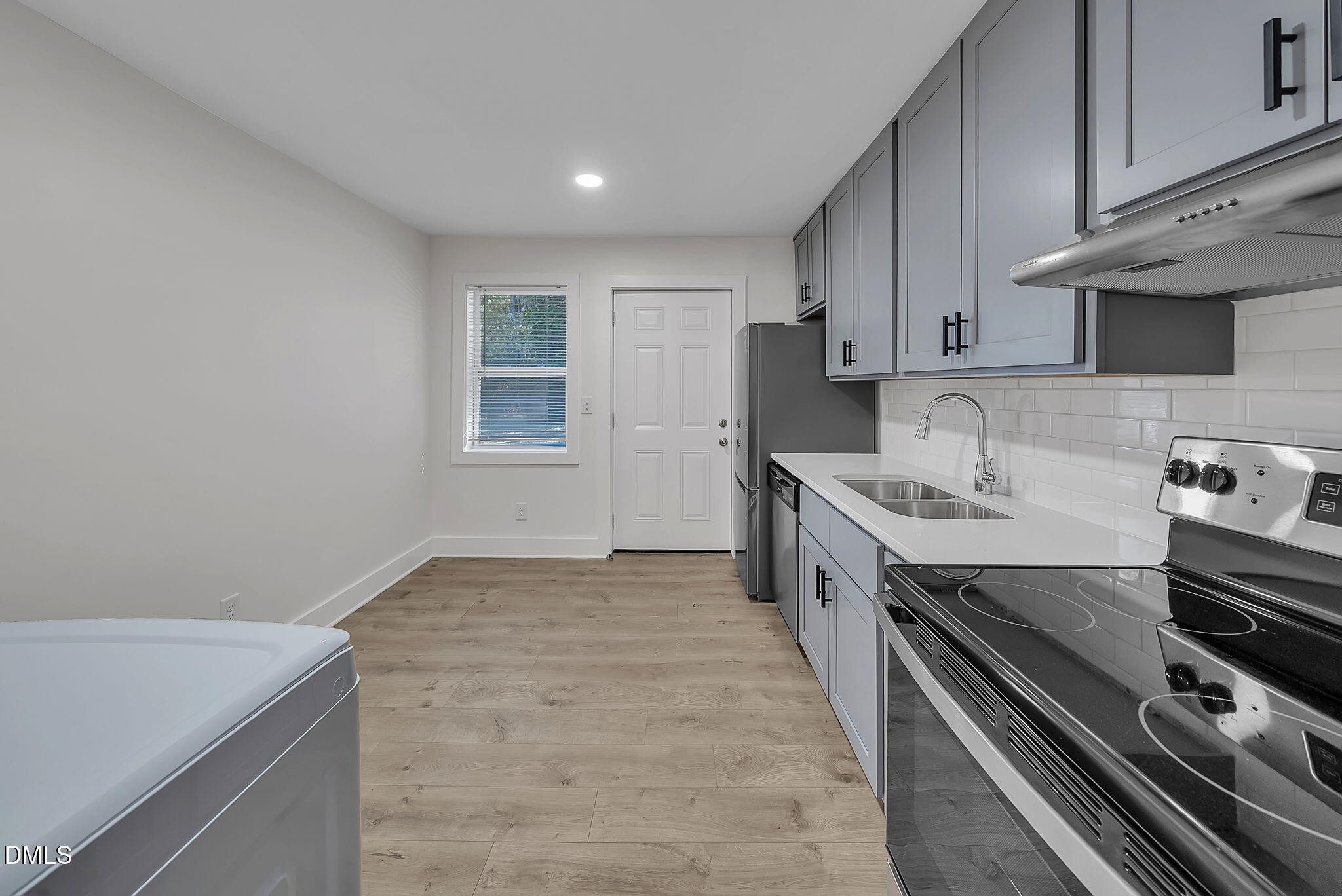510 East Branch Street Spring Hope, NC 27882 - Photo 12 of 32 a kitchen with a stove and a sink