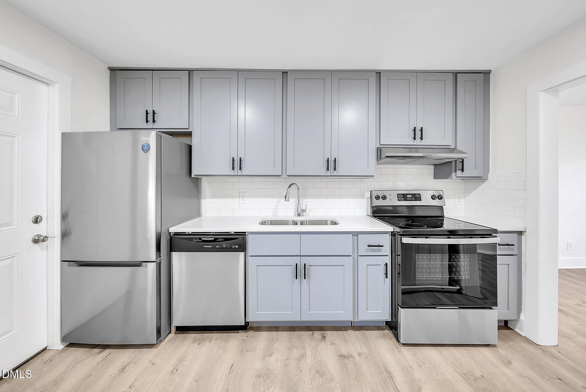 510 East Branch Street Spring Hope, NC 27882 - Photo 16 of 32 a kitchen with stainless steel appliances granite countertop a stove a refrigerator and a sink with wooden cabinets