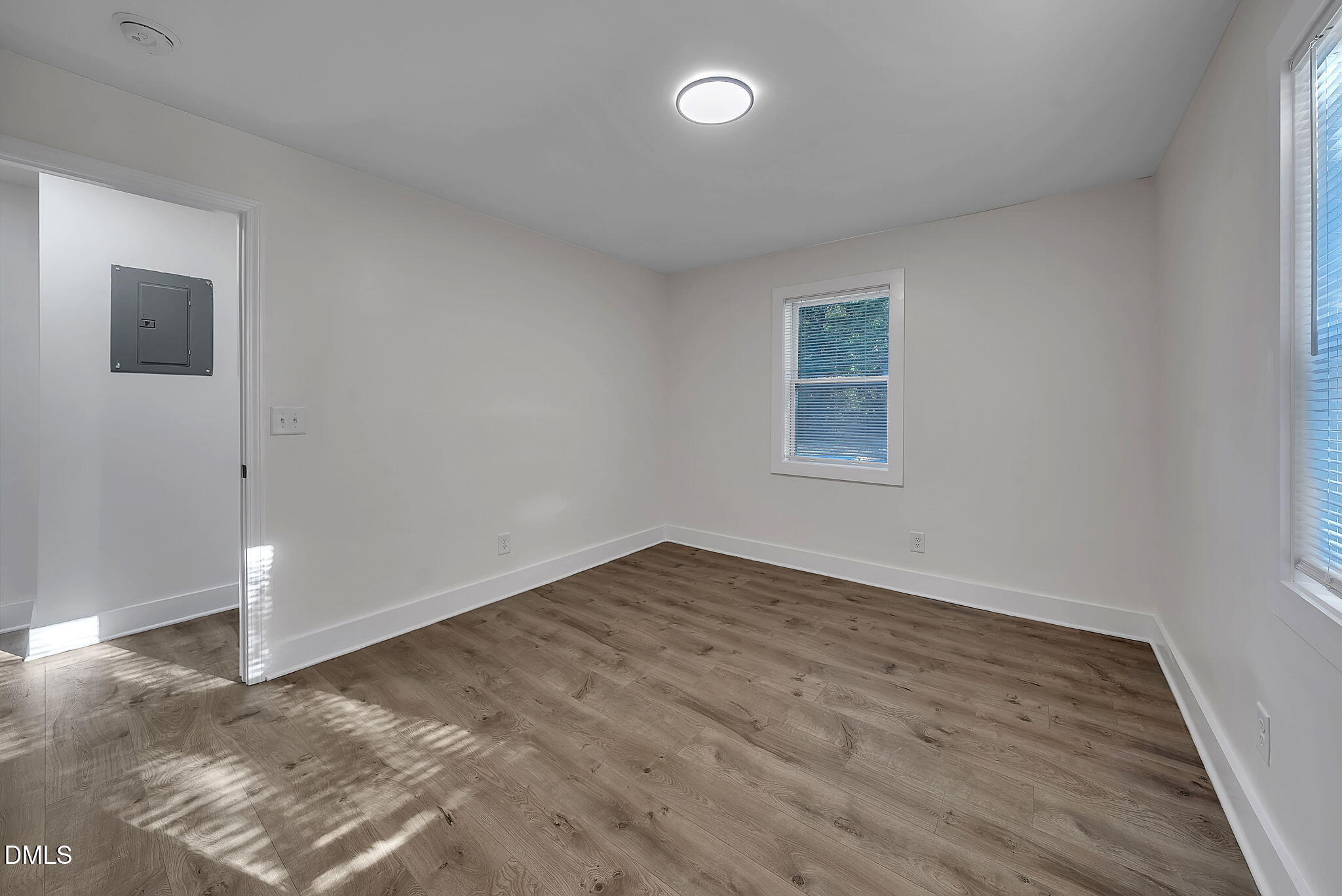 510 East Branch Street Spring Hope, NC 27882 - Photo 22 of 32 an empty room with wooden floor and windows