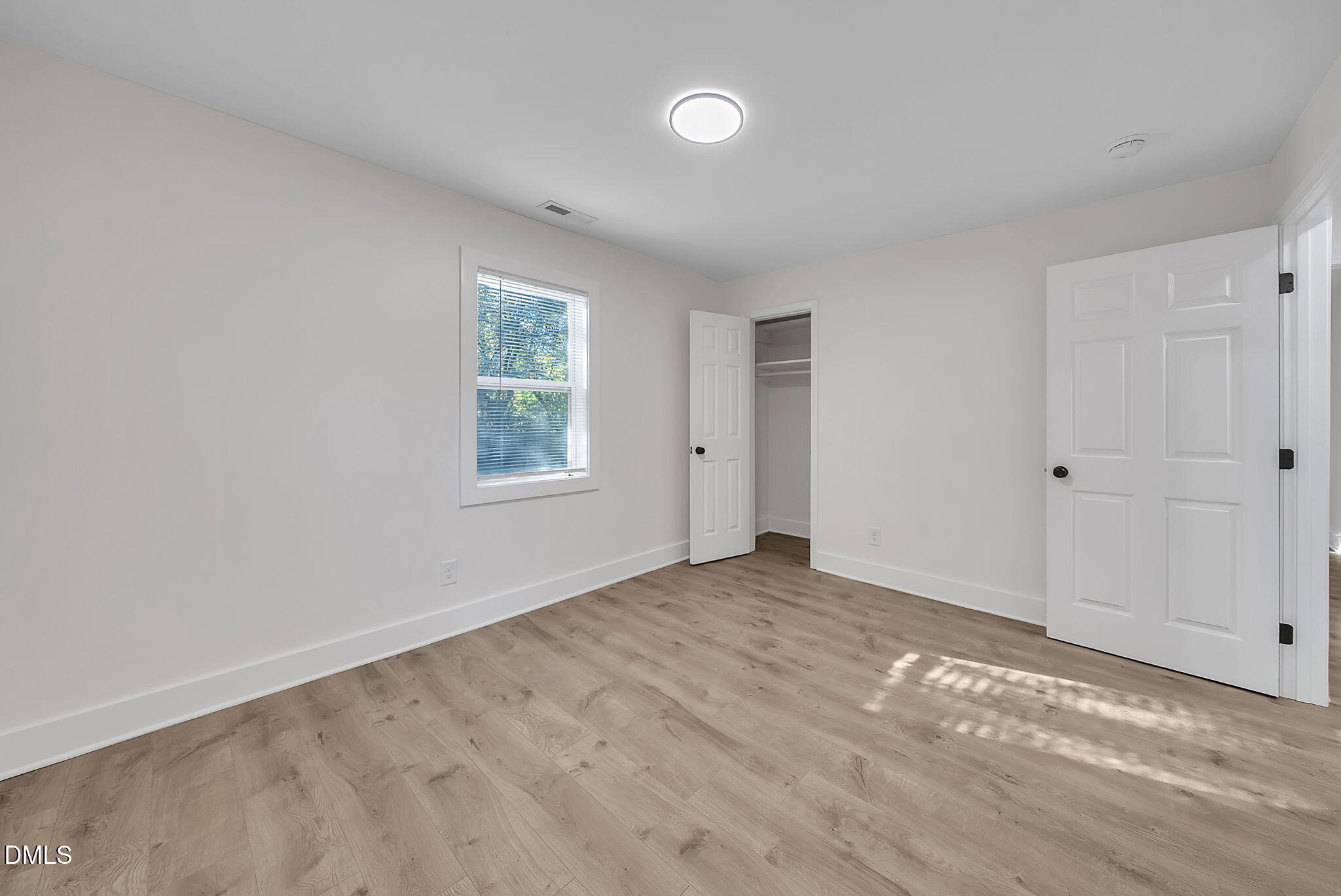 510 East Branch Street Spring Hope, NC 27882 - Photo 24 of 32 wooden floor in an empty room with a window